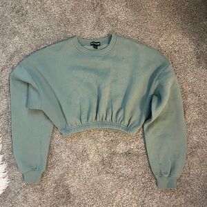 Green Prettylittlething cropped sweatshirt